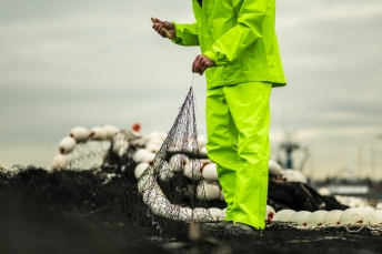 © Cameron Karsten Photography photographs Grundens' new bibs and jacket on the Silver Wave in Seattle, WA